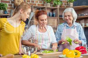 Family cooking together in kitchen