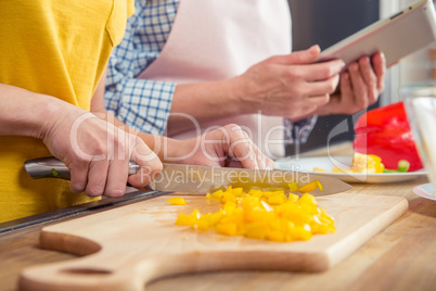 Woman cutting pepper