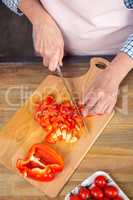Woman cutting pepper