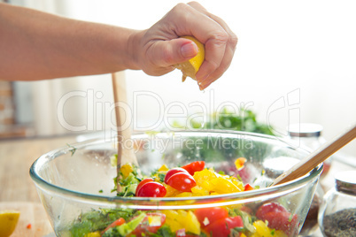 Woman squeezing lemon