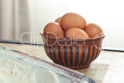 Raw eggs in bowl