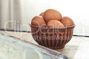 Raw eggs in bowl