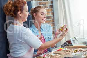 Mother and daughter making cookies