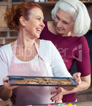 Mother and daughter making cookies