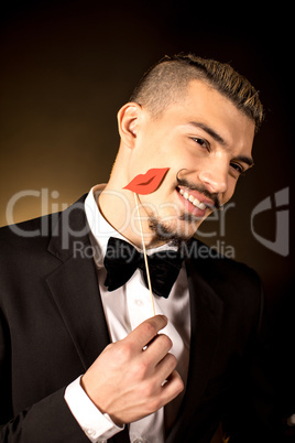 Smiling young man in tuxedo