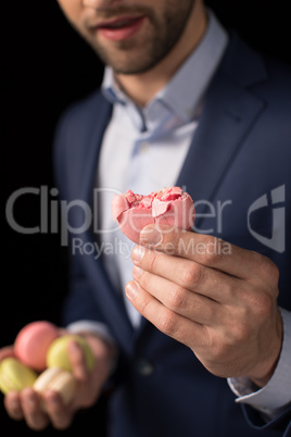 Young man with macaroon