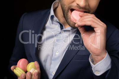 Young man with macaron