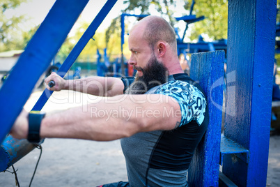 Man training on chest press equipment