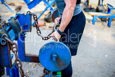 Man with barbell during workout