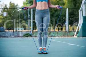 Woman exercising with jump rope