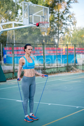 Woman working out with skipping rope