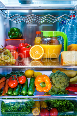 Open refrigerator filled with food