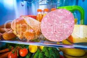 Open refrigerator filled with food