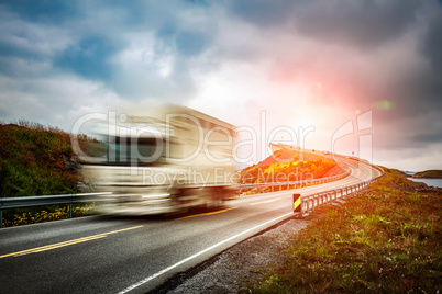 Truck and highway at sunset