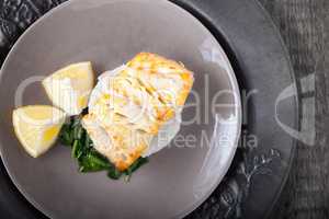 Fried cod fillets and spinach