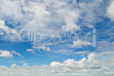 light cumulus clouds in the blue sky