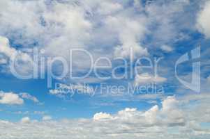 light cumulus clouds in the blue sky