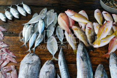 fresh fish and other seafood on a wooden table