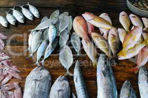 fresh fish and other seafood on a wooden table