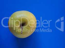 green apple fruit food over blue with copy space