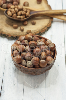 Hazelnut in the shell on a clay plate