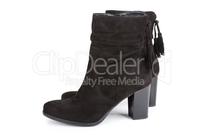 Black ankle boots with a tassel isolated on white