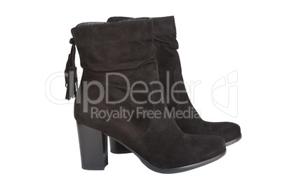 Black ankle boots with a tassel isolated on white