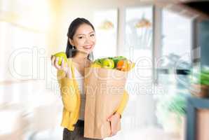 Woman holding groceries bag in market