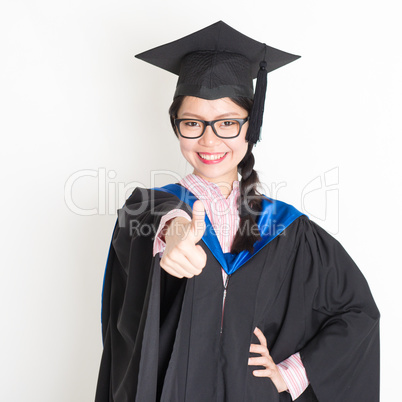 University student thumb up and smiling