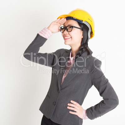 Female engineer looking away