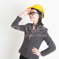 Female engineer looking away