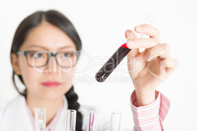 Young female scientist doing experiment