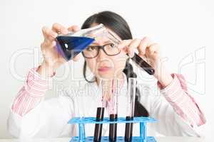 Young female scientist in lab