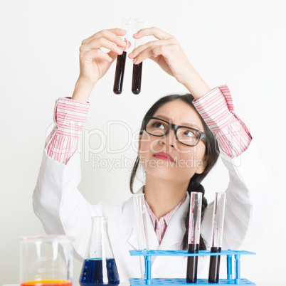 Young female scientist doing research