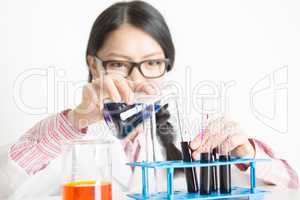Young Asian female scientist doing experiment in lab