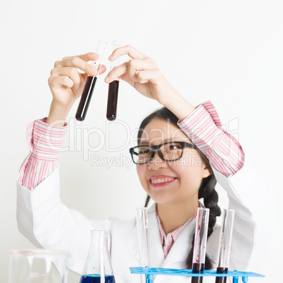 Young female scientist carrying out scientific research