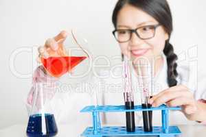 Young Asian female scientist in lab
