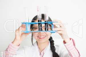Young Asian female scientist carrying out scientific research