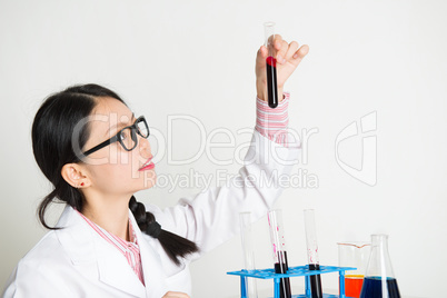 Asian female scientist doing experiment