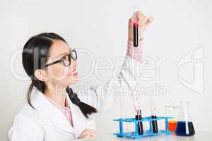 Asian female scientist doing experiment in lab