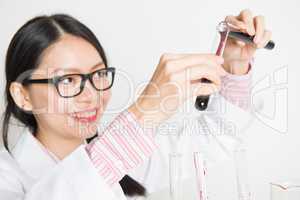 Asian female scientist carrying out scientific research
