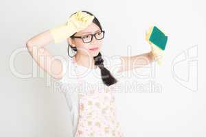 Young Woman Cleaning with sponge
