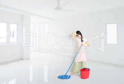 Woman mopping house