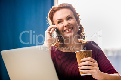 Woman talking on smartphone