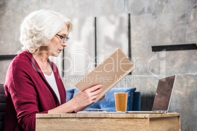 Senior woman reading book