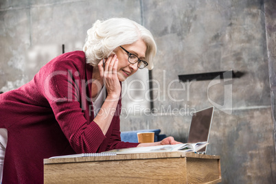 Senior woman reading book