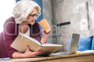 Woman holding paper cup