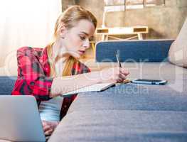 Girl making notes