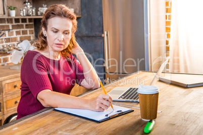 Woman making notes