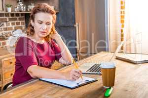 Woman making notes